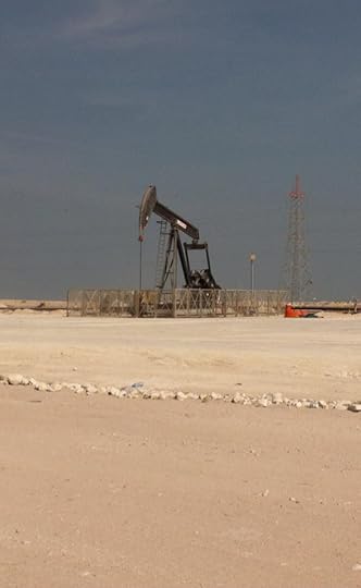 A nodding donkey style oil well in the Bahrain desert oil field