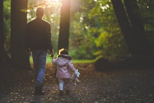 Father and daughter in woods