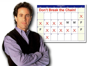 A young Seinfeld is standing, arms crossed, before a monthly calendar page, where some days have been crossed off already.