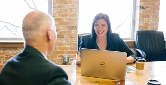 Smiling leader talking to employee