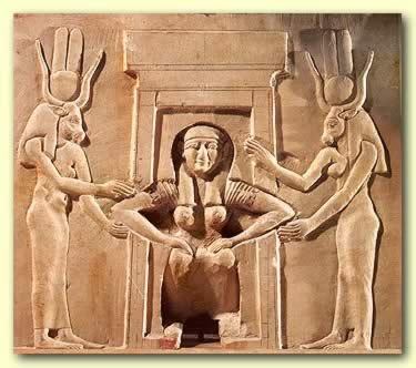 Isis giving birth while squatting on birthing bricks and supported by Divine midwives