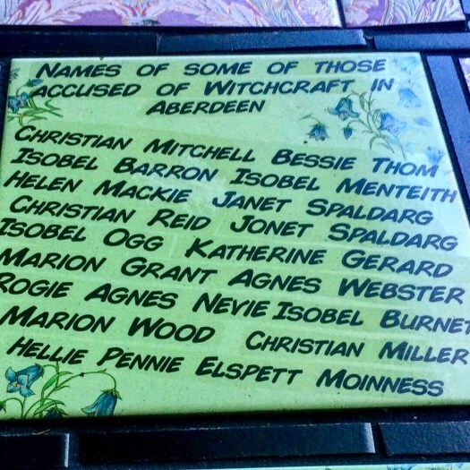 Tile naming some of those accused of being witches in Aberdeen, Scotland. The Witchy Ways of Aberdeen.