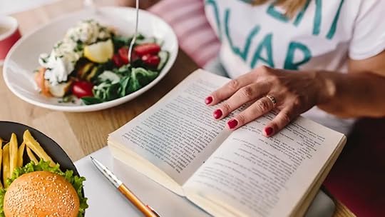Highly distracted with your attention divided between eating and reading.