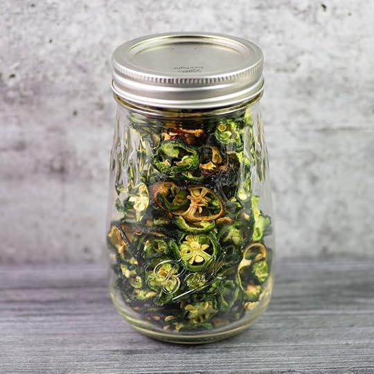 Dehydrated jalapenos in a glass mason jar.