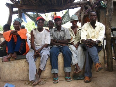 men sitting doing nothing