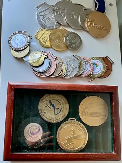 25 medals of various types, lacking ribbons, including four in a shadow box.