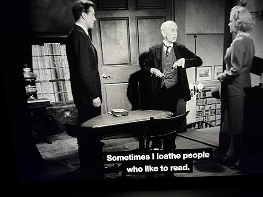 Two men and women standing in a bookstore. Closed caption reads
