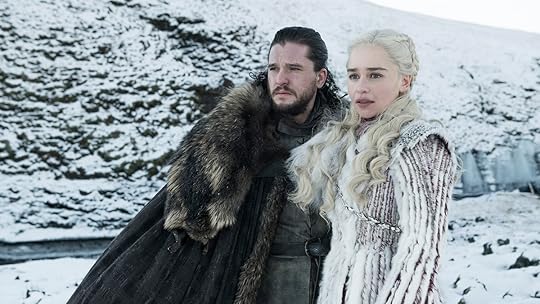Jon Snow in black and Daenerys in white in the snow on Game of Thrones