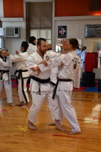 Master Will Just working a Knife Hand Strike whilst walking his opponent down the line