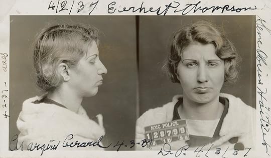 Two men in uniform working on a radio in the woods.