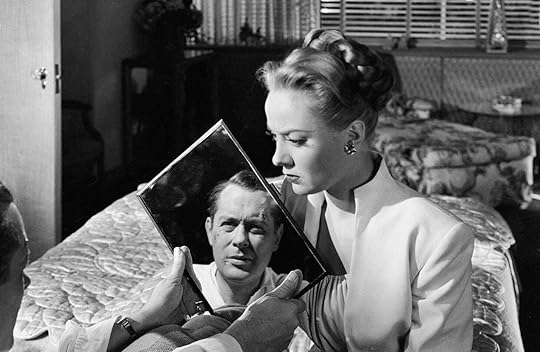 Audrey Totter looks at Robert Montgomer's reflection in
