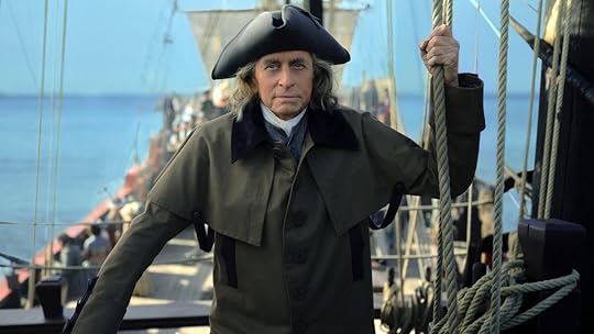 Michael Douglas ina. tri corner hat stands on a boat as Benjamin Franklin