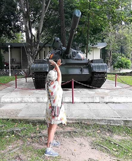 Janice Horton in front of a tank in the grounds of the Independence Palace HCMC
