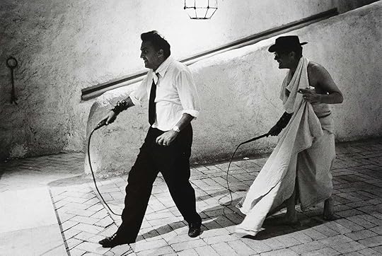 Federico Fellini and Marcello Mastroianni wield whips on set of