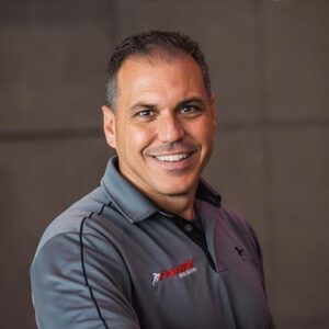 A portrait headshot of Bill Parisi.