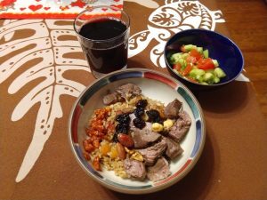 Kabsa, tomato-cucumber salad, and Shiraz wine