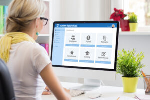 Woman watching a human resources demonstration on her computer