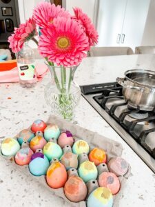 The finished DIY Confetti Easter Eggs in an egg cartoon