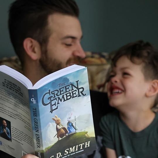 father and son reading The Green Ember