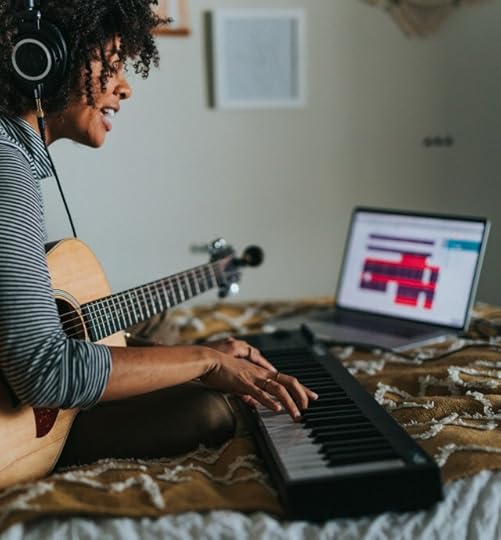 person with musical instruments learning a lesson