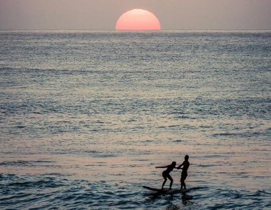 person learning a lesson surfing