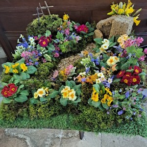 photo of Easter Garden on tabletop showing Jesus's tomb and three crosses