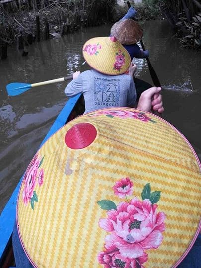 Paddling a traditional Canoe On the Mekong River Delta Adventure