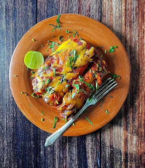 A plate of venison enchiladas.