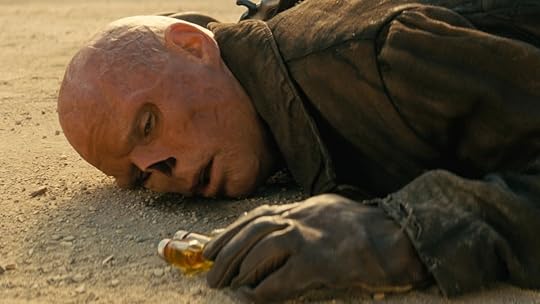 The Ghoul lying on the ground next to vials of medicine on Fallout