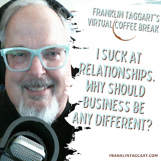 Franklin Taggart at the microphone with his earphones on, wearing his bakelite glasses and smiling.