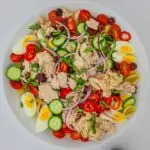 platter of tuna pasta salad on white table.