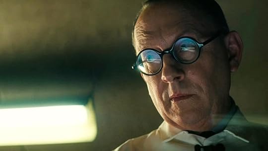 Wilzig with glasses reflecting what he's looking at on from Fallout