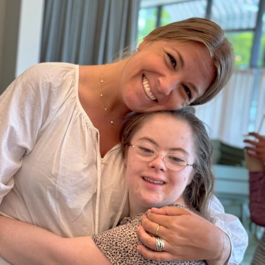 Penny and a friend from Hope Heals give each other a big hug