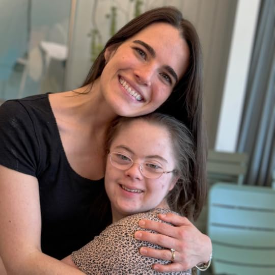 Penny and a friend from Hope Heals give each other a big hug