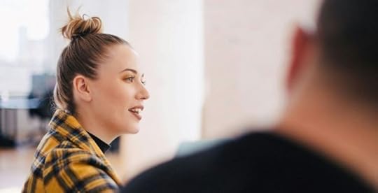 Photo of an incoming leader talking to her team