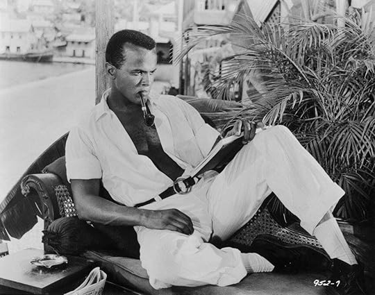 Harry Belafonte reads a book in