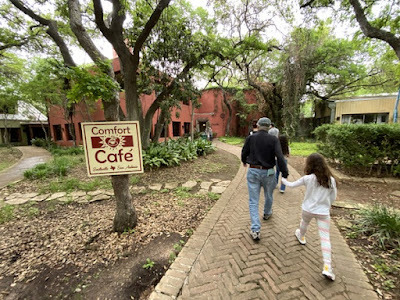 skipping to entrance of Comfort Cafe in San Antonio, Texas