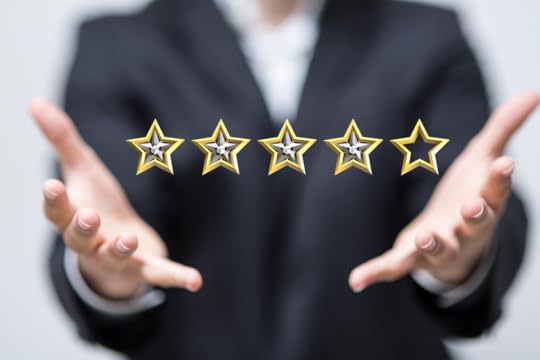 Two extended hands with five stars floating between them with four of the stars filled in.