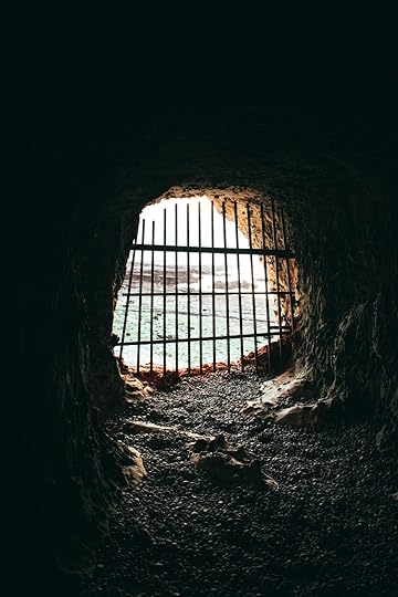 brown cave with black metal frame