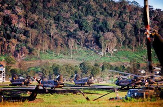 A CH-47 Chinook based at the Army’s First Cavalry Division base, known as the “Golf Course,” lifts off with a 105 mm howitzer on a sling. At the bottom left is the gun crew. Photo courtesy of the author.