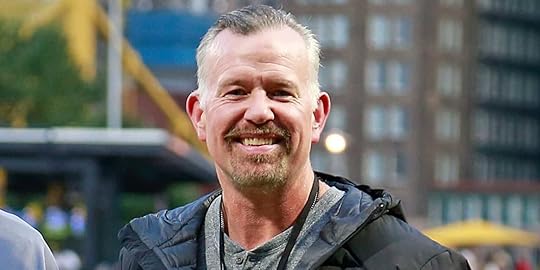 Sean Casey MLB All-star smiling at the camera on a baseball field