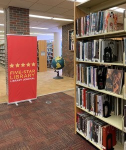 Five star library sign; bookshelves