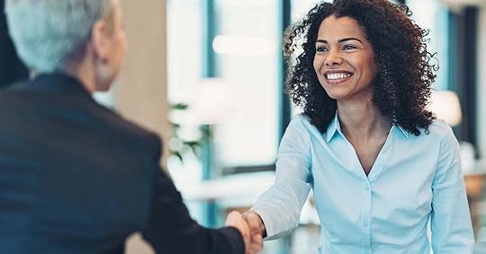 A seller greets an executive-level buyer for a meeting.