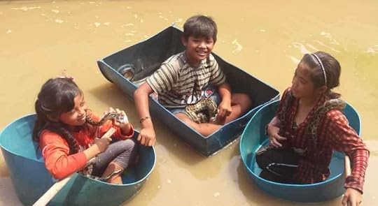 Children asking for ‘one dollar!’ to take a photo - notice the snakes!