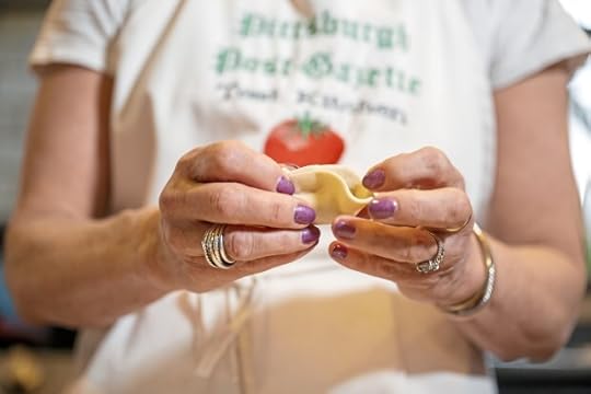 Gretchen McKay pinches one of her homemade dumplings to keep the filling in before she broils it in her kitchen on Wednesday, April 3, 2024, in Avon. (Benjamin B. Braun/Pittsburgh Post-Gazette/TNS)