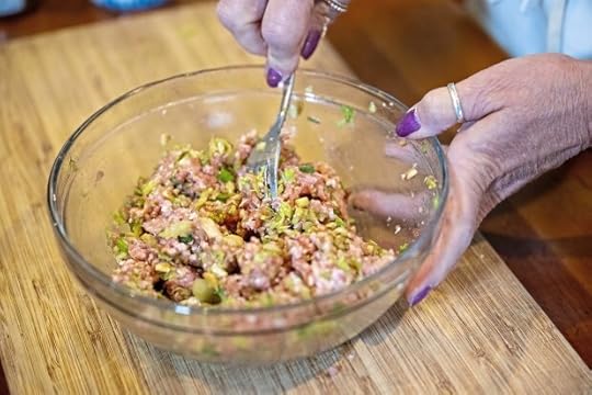 Gretchen McKay mixes homemade dumpling filling in her kitchen on Wednesday, April 3, 2024, in Avon. (Benjamin B. Braun/Pittsburgh Post-Gazette/TNS)