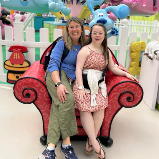 photo of Penny and a friend sitting in a Blue's Clues red chair