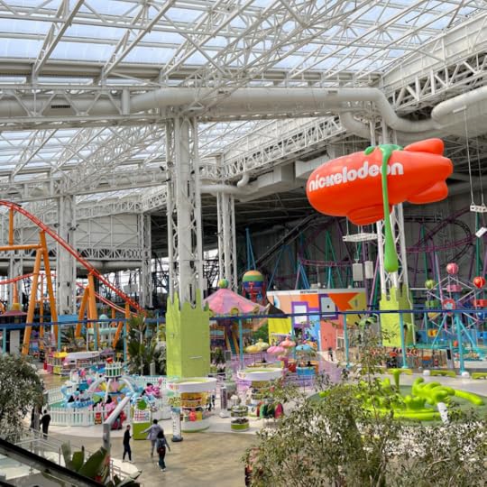 photo of Penny and an adult friend sitting in a Blue's Clues red chair