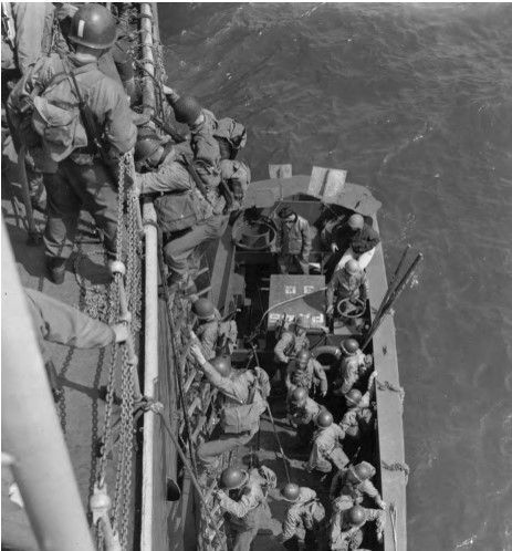 In Exercise Fabius, US infantry descend into an LCVP during D-day invasion practice, Slapton Sands, England, May 1944 (US Army Center of Military History)