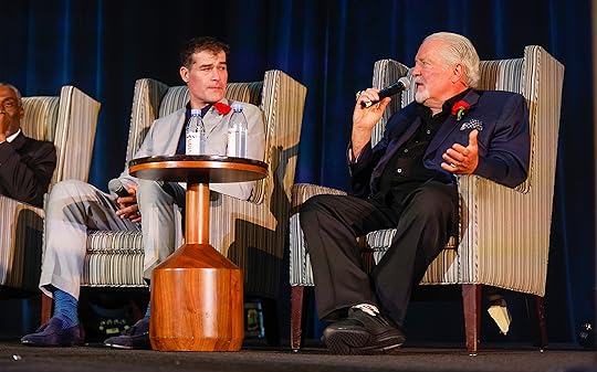 Brian Sabean, right, speaks during a panel next to Patrick...